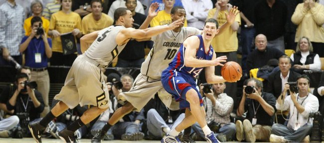 Kansas guard Tyrel Reed breaks through a trap by Colorado defenders Marcus Relphorde (5) and Alec Burks (10) late in the second half Tuesday, Jan. 25, 2011 at the Coors Events Center in Boulder.
