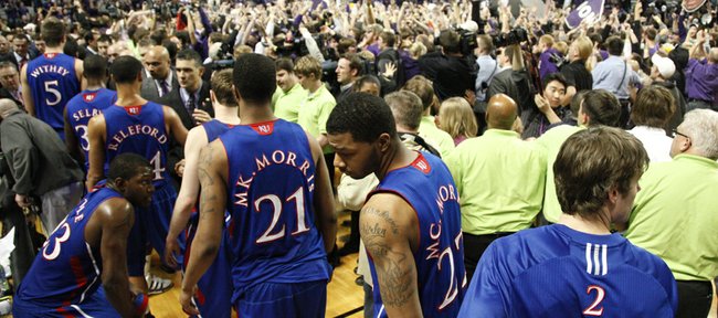 Kansas players leave the floor as the Kansas State student section rushes the court after the Wildcats defeated the Jayhawks, 84-68, on Monday, Feb. 14, 2011 at Bramlage Coliseum.