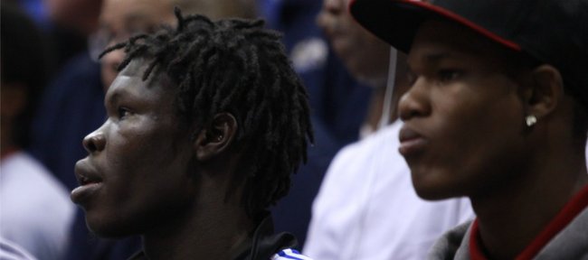 Kansas recruit Angelo Chol, left, watches the action next to fellow KU recruit Ben McLemore during Late Night in the Phog, Friday, Oct. 15, 2010.