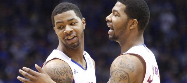 Brother Marcus Morris, left, and Markieff Morris congratulate each other after grabbing a foul against Iowa State during the first half on Saturday, Feb. 12, 2011 at Allen Fieldhouse.