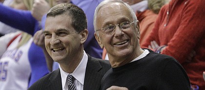 Texas A&M coach Mark Turgeon, left, and former Kansas coach Larry Brown visit before the Jayhawks take on the Aggies on Wednesday, March 2, 2011. Turgeon played on Brown's team while at KU.