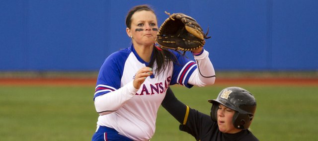 Kansas University’s Marissa Ingle, left, can’t get the tag in time at third base against Missouri’s Jenna Marston. The Tigers swept a doubleheader, 3-2 and 6-5, against the Jayhawks on Wednesday at Arrocha Ballpark.