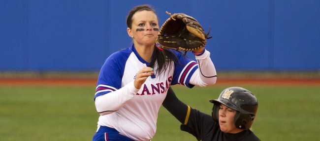 Kansas University’s Marissa Ingle, left, can’t get the tag in time at third base against Missouri’s Jenna Marston. The Tigers swept a doubleheader, 3-2 and 6-5, against the Jayhawks on Wednesday at Arrocha Ballpark.