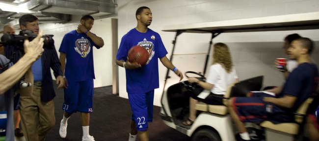 Marcus (with ball) and Markieff Morris encounter Richmond players in a golf cart at the Alamodome on Thursday, March 24, 2011. During the encounter, Marcus said, “You boys better be ready.”