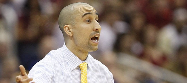 Virginia Commonwealth head coach Shaka Smart gets the attention of his defense during the first half on Friday, March 25, 2011 at the Alamodome in San Antonio.