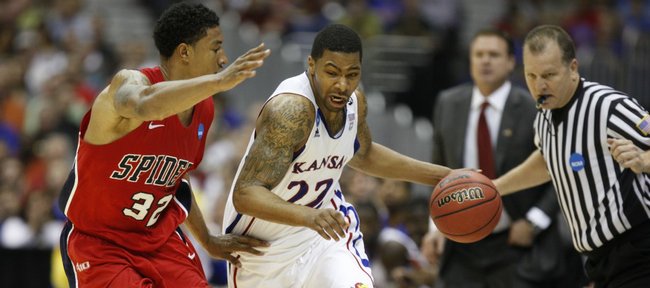 Kansas forward Marcus Morris drives against Richmond forward Justin Harper during the first half on Friday, March 25, 2011 at the Alamodome in San Antonio.