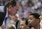 Kansas assistant coach Joe Dooley looks to pump up Morris twins, Marcus, center, and Markieff during the second half Sunday March 22, 2009 at the Metrodome in Minneapolis.