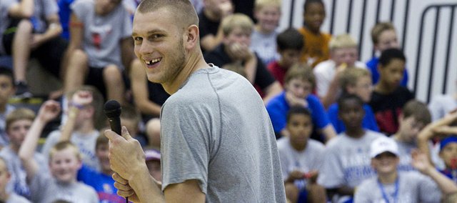 Oklahoma City Thunder player and former Jayhawk Cole Aldrich speaks before a large group of participants at the Bill Self basketball camp Monday, June 6, 2011 at Horejsi Center.