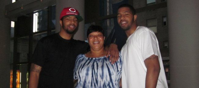 Kansas University forwards Marcus Morris, left, and Markieff Morris, right, flank their mother, Angel, inside the Westin Times Square in New York on Wednesday, June 20, 2011. Angel was the first recipient of Headquarters Counseling Center's Life Saver Award.  The center is seeking nominations for its 2012 recipient.