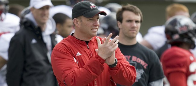 Northern Illinois coach Dave Doeren offers encouragement from the sideline during a Huskies practice. Doeren served as Kansas University co-defensive coordinator in 2005 and recruited some of the most memorable names to Lawrence. NIU will visit Kansas this season for a Sept. 10 contest in Memorial Stadium.