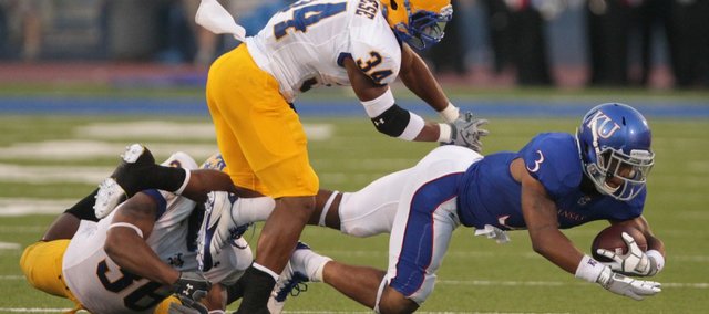 McNeese State safeties Malcolm Bronson (34) and Ryan Bronson bring down Kansas running back Darrian Miller during the second quarter on Saturday, Sept. 3, 2011 at Kivisto Field.