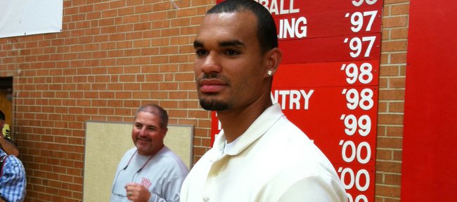 Wichita Heights basketball player Perry Ellis stands after announcing his decision to attend Kansas on Wednesday, Sept. 21, in Wichita.