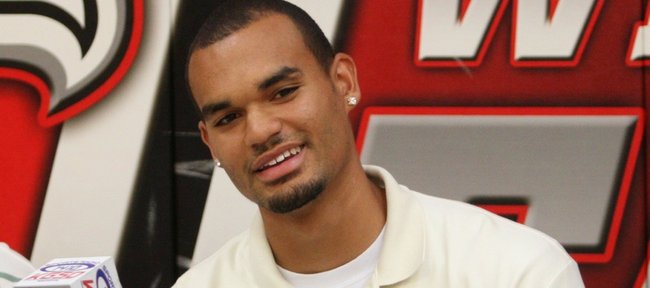 Basketball recruit Perry Ellis signed a national letter of intent with Kansas on Wednesday.