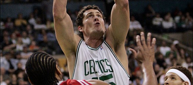 
Boston's Raef LaFrentz shoots over Houston's Derek Anderson (8) during the first quarter. The Celtics won, 102-82, Sunday in Boston as LaFrentz tied his career high in points and went 7-for-9 from three-point range.