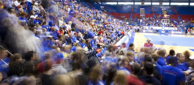 A rush of basketball fans enter Allen Fieldhouse for Late Night in the Phog on Friday, Oct. 14, 2011.