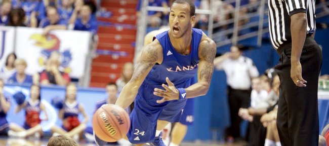 Kansas guard Travis Releford scoops a pass up the court after stealing the ball from Conner Teahan during the Late Night in the Phog scrimmage on Friday, Oct. 14, 2011 at Allen Fieldhouse.