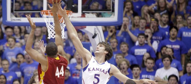 Kansas center Jeff Withey gets a hand Pittsburg State forward JaVon McGee's shot during the first half Tuesday, Nov. 1, 2011 at Allen Fieldhouse.
