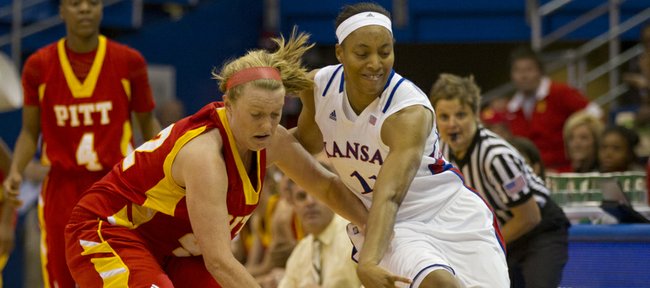 Kansas’ Aishah Sutherland, right, knocks the ball away from Pitt State’s Lizzy Jeronimus during Kansas’ final exhibition game against Pittsburg State Sunday, Nov. 6, 2011 at Allen Fieldhouse. The Jayhawks, who won 68-43, open the season at home against Western Michigan on Nov. 13. 
