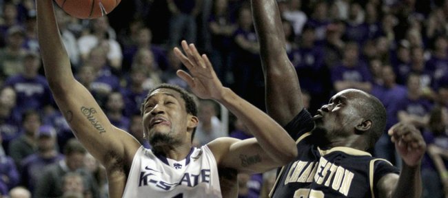 Kansas State guard Shane Southwell (1) gets past Charleston Southern forward Mathiang Muo (23) to put up a shot during the second half Friday, Nov. 11, 2011, in Manhattan, Kan. Kansas State won the game, 72-67.