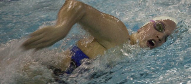 Kansas swimmer Rebecca Swank churns though the water on her way to first place in the 1000 freestyle against Missouri on Friday, Nov. 11, 2011 at Robinson Natatorium.