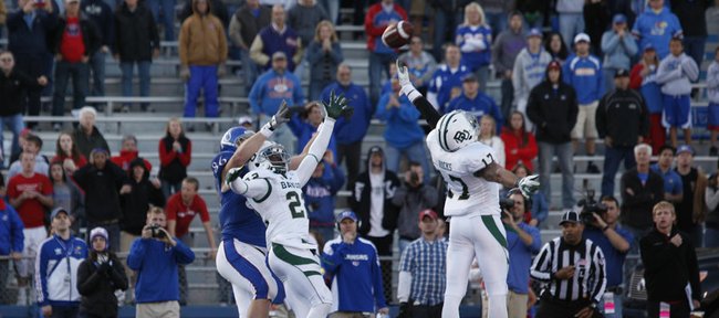 Kansas tight end Tim Biere can't come down with a two-point conversion attempt as he is boxed out by Baylor defenders Joe Williams (22) and Mike Hicks (17) during overtime on Saturday, Nov. 12, 2011 at Kivisto Field.