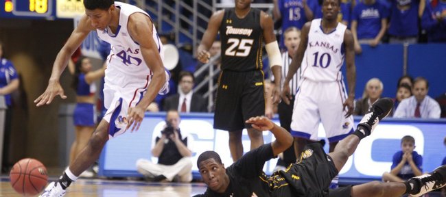 Kansas forward Kevin Young comes away with a steal from Towson forward Enrique Gumbs during the first half on Friday, Nov. 11, 2011 at Allen Fieldhouse.