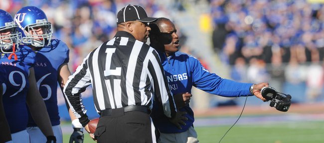 Kansas head football coach Turner Gill speaks with an official as KU took on Baylor on Saturday, Nov. 12, 2011 at Memorial Stadium.