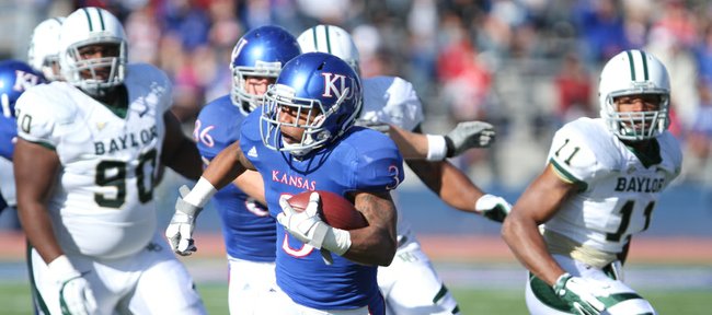 Kansas running back Darrian Miller races up the field for a first down against Baylor during the first quarter on Saturday, Nov. 12, 2011 at Kivisto Field. The run helped put the Jayhawks in field goal range.