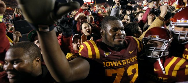 Iowa State offensive linesman Kelechi Osemele reacts with fans after his team's 37-31 in double overtime win over Oklahoma State on Friday, Nov. 18, 2011, in Ames, Iowa.