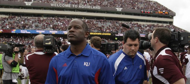 Kansas head coach Turner Gill walks off the field after falling to Texas A&M, 61-7, Saturday, Nov. 19, 2011 at Kyle Stadium in College Station, Texas.