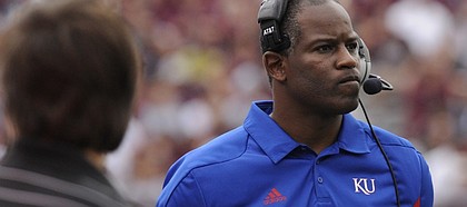 Kansas head coach Turner Gill walks the sidelines during the first half Saturday, Nov. 19, 2011 at Kyle Stadium in College Station, Texas.