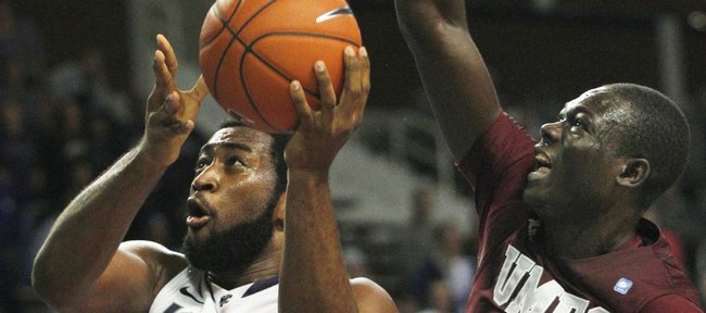 Kansas State forward Thomas Gipson (42) gets past Maryland-Eastern Shore center Pina Guillaume (44) during the second half Tuesday, Nov. 22, 2011, in Manhattan, Kan.