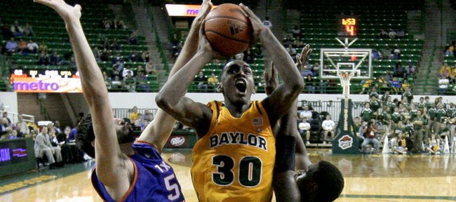 Texas-Arlington forward Jordan Reves, left, and Bo Ingram (1) defend against a shot attempt by Baylor forward Quincy Miller (30) in the second half Wednesday, Nov. 23, 2011, in Waco, Texas. Baylor won 75-65.
