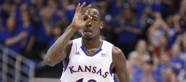 Kansas guard Tyshawn Taylor signals to the bench after hitting a three-pointer against South Florida during the second half on Saturday, Dec. 3, 2011 at Allen Fieldhouse.