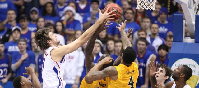 Kansas center Jeff Withey fights for a rebound against Long Beach State during the first half Tuesday, Dec. 6, 2011 at Allen Fieldhouse.
