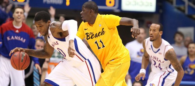 Kansas forward Thomas Robinson comes away with a steal as he is pressured by Long Beach State forward James Ennis during the first half Tuesday, Dec. 6, 2011 at Allen Fieldhouse.