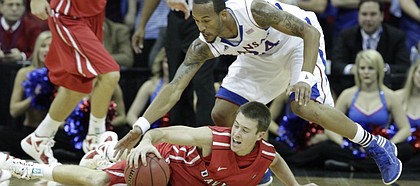 Kansas guard Travis Releford scrambles for a loose ball in the first half against Davidson on Monday, Dec. 19, 2011 at Sprint Center in Kansas City, Mo.