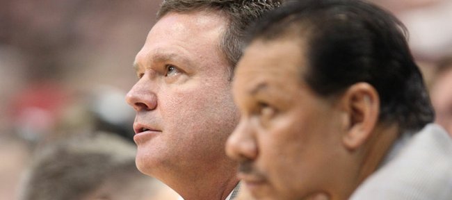 Kansas head coach Bill Self adjusts his tie as he watches from the bench next to assistant Kurtis Townsend during the second half on Saturday, Dec. 31, 2011 at Allen Fieldhouse.