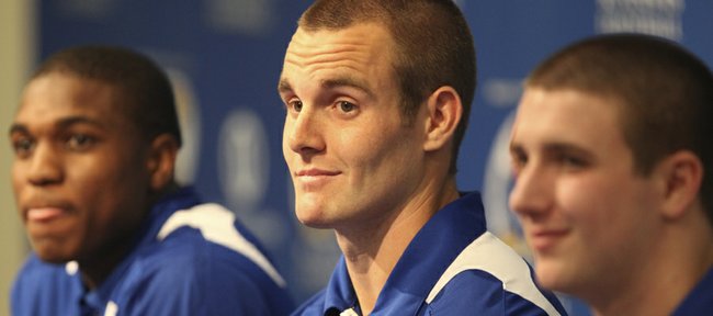 Kansas quarterback Dayne Crist, a transfer from Notre Dame, listens to a question from a media member between receiver Justin McCay, a transfer from Oklahoma, left, and quarterback Jake Heaps, a transfer from BYU, on Monday, Jan. 16, 2012 at the Anderson Family Football Complex.