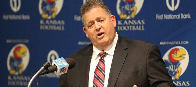 Kansas head football coach Charlie Weis talks with media members on Monday, Jan. 16, 2012 at the Anderson Family Football Complex. Weis introduced new members of his football team and also announced players that have left the program.