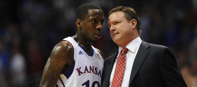 Kansas guard Tyshawn Taylor and KU coach Bill Self have some words during the first half of Monday's game against Baylor.