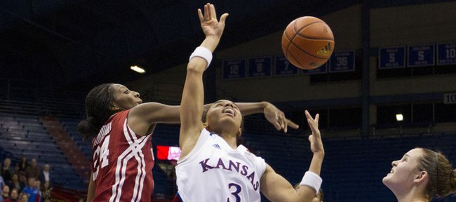 Kansas guard Angel Goodrich (3) has her shot rejected by Oklahoma forward Jacqueline Jeffcoat during Kansas’ game against Oklahoma Tuesday, Jan 31, 2012, at Allen Fieldhouse.
