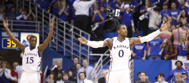 Kansas players Thomas Robinson (0) and Elijah Johnson (15) raise up the fieldhouse during a run by the Jayhawks in the second half on Wednesday, February 1, 2012 at Allen Fieldhouse.