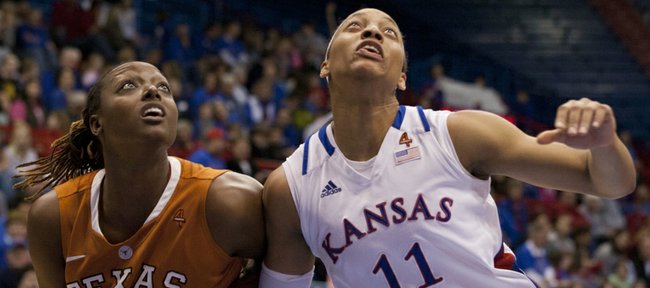 Kansas forward Aishah Sutherland (11) and Texas’ Ashley Gayle (22) struggle for rebounding position during Kansas’ game against Texas on Wednesday, Feb. 8, 2012, at Allen Fieldhouse.
