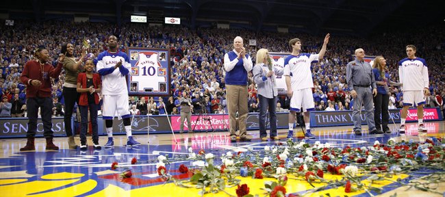 Kansas seniors Tyshawn Taylor, left, Conner Teahan and Jordan Juenemann are recognized before the fieldhouse crowd with their families prior to tipoff against Texas on Saturday, March 3, 2012 at Allen Fieldhouse.
