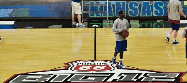 Kansas University guard Tyshawn Taylor stands at halfcourt of the Sprint Center during a brief shootaround in preparation for the Big 12 tournament opener against Texas A&M in this 2012 file photo. The Big 12 signed an extension Friday to keep the league's men's basketball tournament in K.C. through 2016.