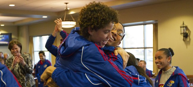 Kansas junior Monica Engelman, left, hugs senior forward Aishah Sutherland while the rest of the team celebrates after the team learned its NCAA tournament fate during a tournament selection watch party held in the Naismith Room in Allen Fieldhouse Monday, March 12, 2012. The Jayhawks received the number eleven seed in the Des Moines region and will face  sixth seeded Nebraska in the first round.