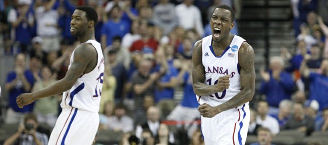 Kansas guard Tyshawn Taylor goes wild after a three by teammate Elijah Johnson, left, put the Jayhawks up by one for their first lead of the game against Purdue during the second half on Sunday, March 18, 2012 at CenturyLink Center in Omaha.