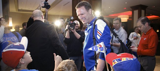 Kansas coach Bill Self greets several young Jayhawk fans following a brief interview with media members as the team arrives on Wednesday, March 21, 2012, at the Hyatt Regency St. Louis at the Arch. 