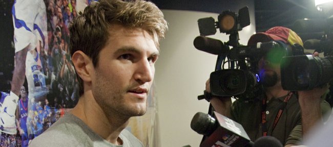 Kansas University center Jeff Withey talks with media during interviews Tuesday, March 27, 2012, outside the KU team locker room. The KU men's basketball team heads to New Orleans Wednesday in advance of the Final Four.